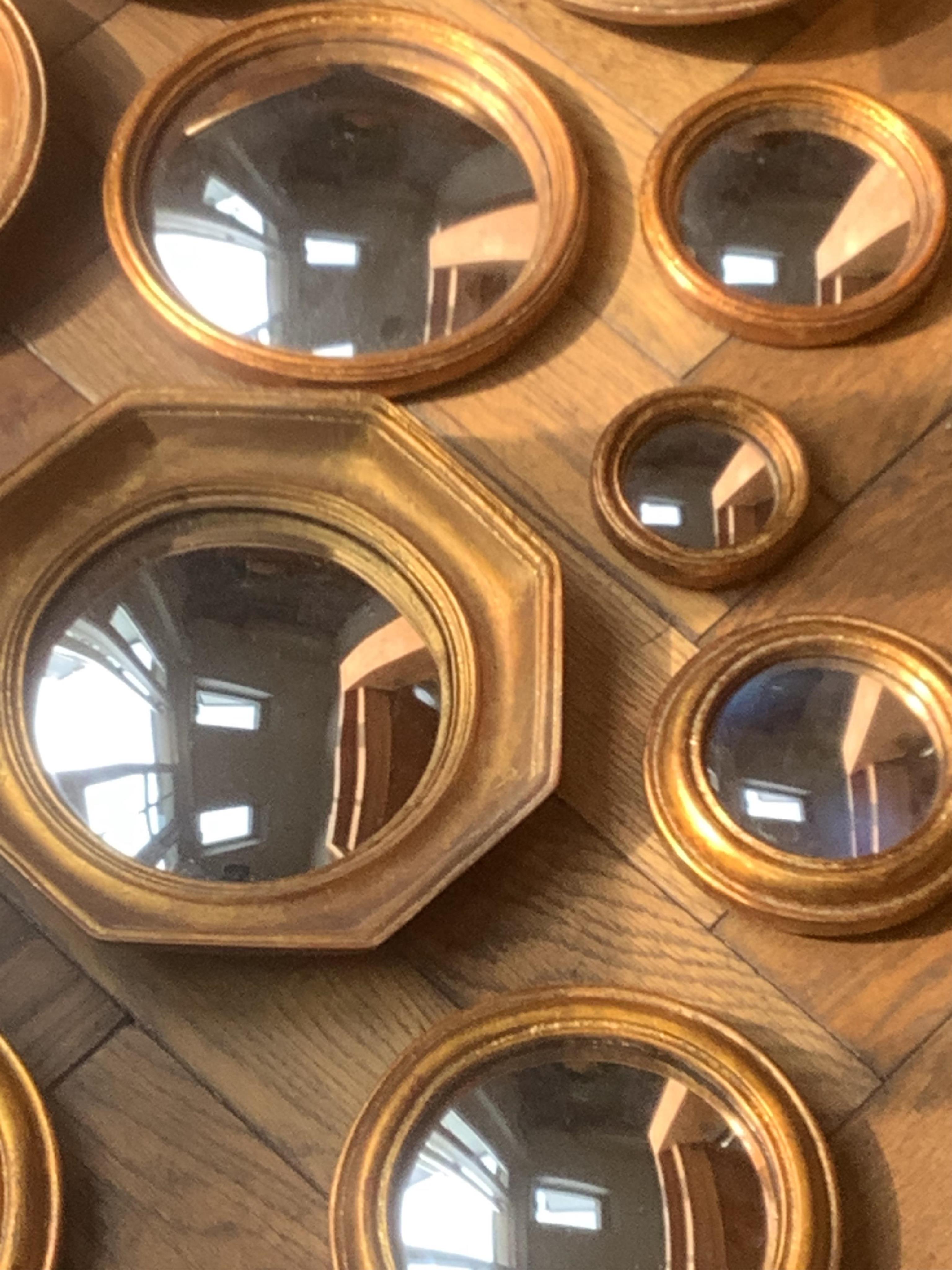 A group of twelve small gilt frame convex wall mirrors, largest 26cm diameter. Condition - good, some light scratches to frames